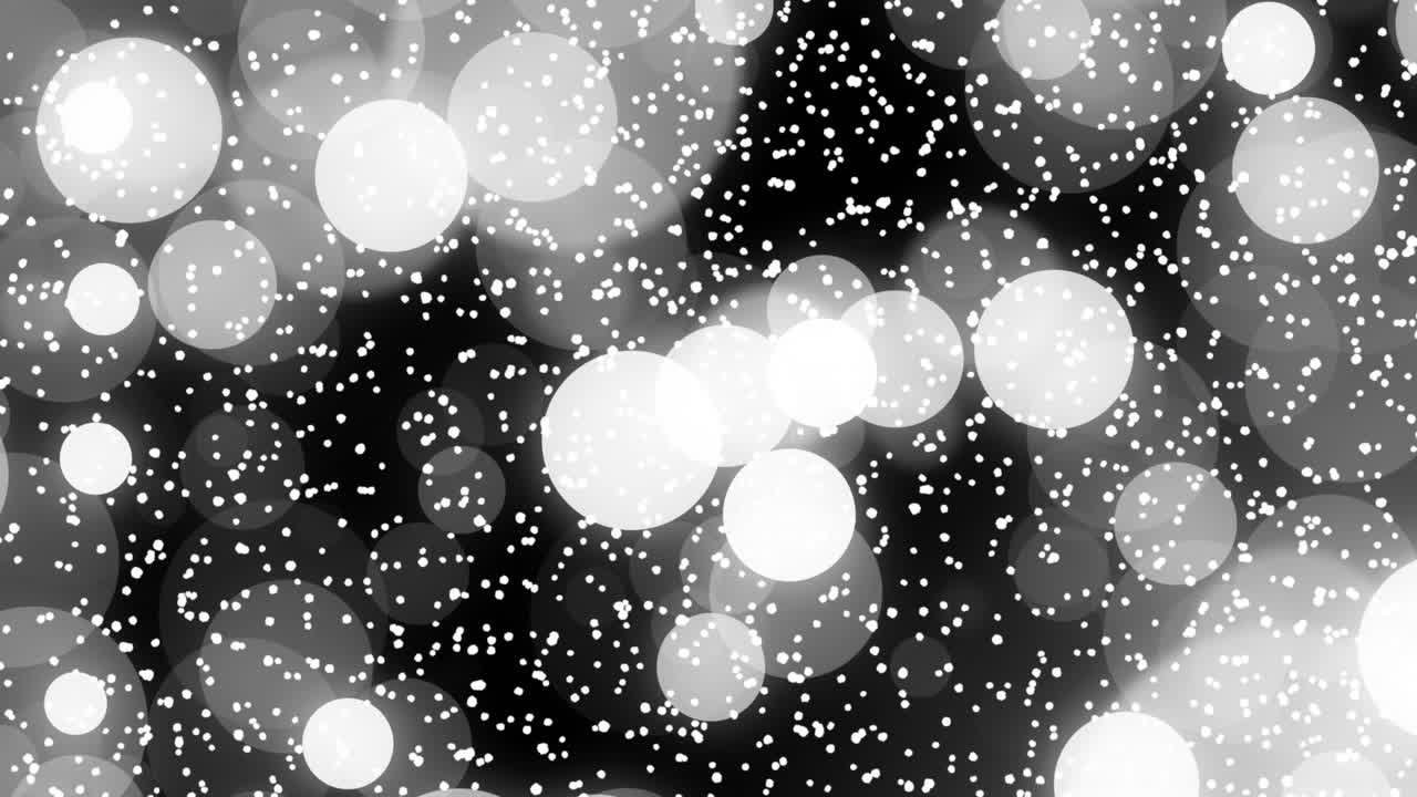 Fotogrammi iniziali che mostrano dense particelle bianche, poi cerchi sfocati che si spostano, creando un effetto bokeh