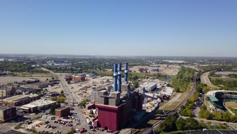 Aerial-establishing-shot-of-a-large-factory-with-smokestacks-at-Indianapolis