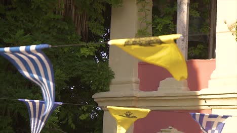 small triangular flags hanging on lines over a square