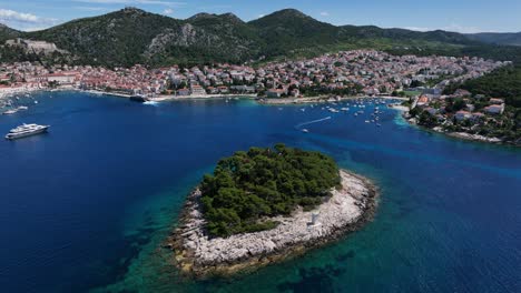 scenic aerial shot of hvar town, jerolim and pakleni islands with boats on the adriatic sea
