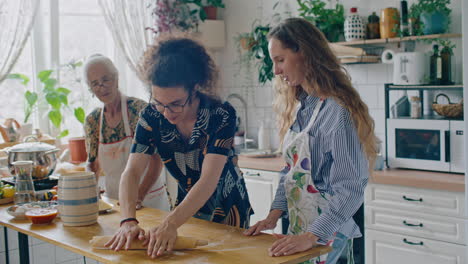 boy learning dough rolling together with sister and grandmother in home kitchen