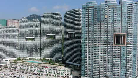 Hong-Kong-Cyberport-waterfront-park-luxury-residential-buildings,-Aerial-view