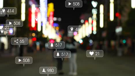 Animation-of-social-media-icons-and-numbers-over-out-of-focus-city-and-car-lights