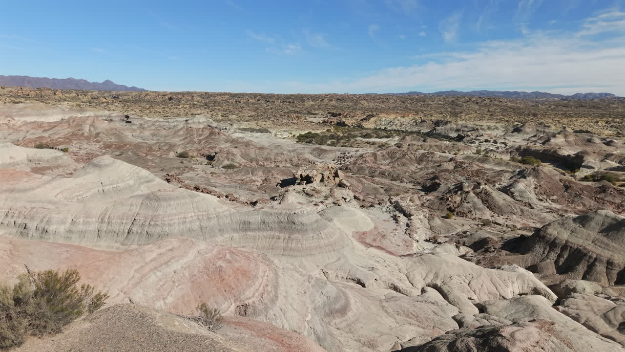 Drone aerial view of Valle Pintado’s colorful striped hills and rugged desert terrain in Ischigualasto, Argentina