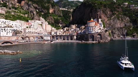 Establishing-Aerial-View-Above-Atrani-Beach,-Coastal-Town