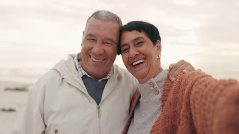 Old-couple,-hug-and-selfie-on-the-beach