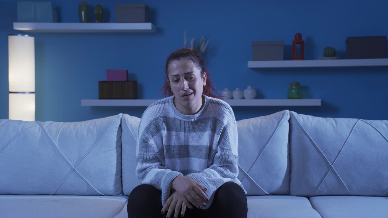 The woman who is angry at the camera.