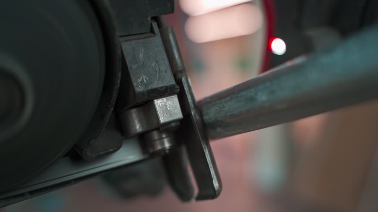 ELECTRICIAN CUTTING EMT PIPE WITH BANDSAW