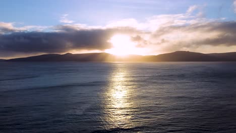 Aerial-view-of-sun-setting-behind-Vagar-Faroe-Islands