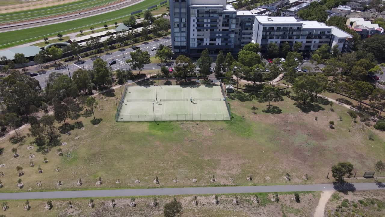 Aerial drone above local tennis court in Kensington, Melbourne, on a sunny day