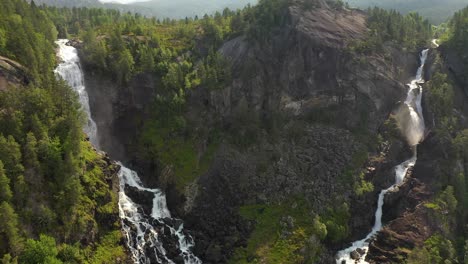 Latefossen-is-one-of-the-most-visited-waterfalls-in-Norway-and-is-located-near-Skare-and-Odda-in-the-region-Hordaland,-Norway.-Consists-of-two-separate-streams-flowing-down-from-the-lake-Lotevatnet.