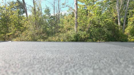 Car-passing-a-drone-parked-on-the-bed-of-a-Truck