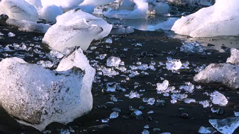 icebergs sit on black sand diamond beach jokulsarlon in the arctic iceland polished and glistening like jewels 3