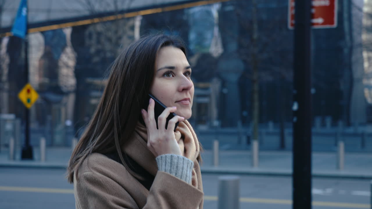 Woman on a Phone Call in a City