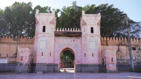 nador , morocco: arched, exterior door to mosque surrounded by colorful mosaic tiles