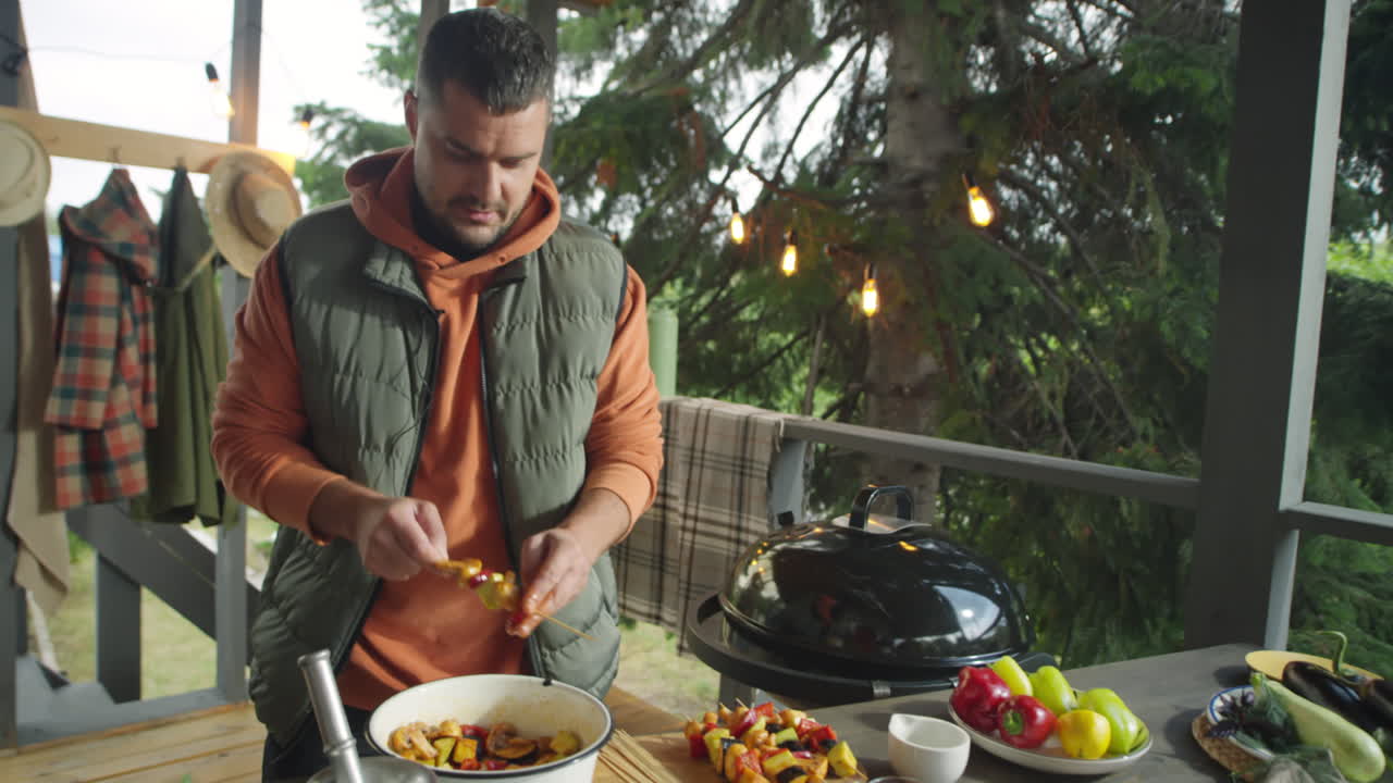 Culinary Blogger Preparing Veggie Skewers for BBQ
