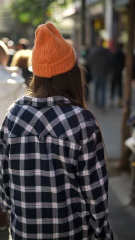 woman walking down a city street