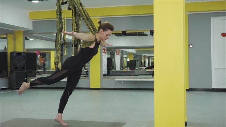 Woman practicing aerial yoga