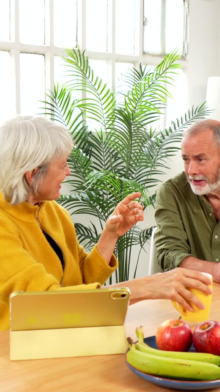 Happy Senior Couple Enjoying a Healthy Meal and Conversation