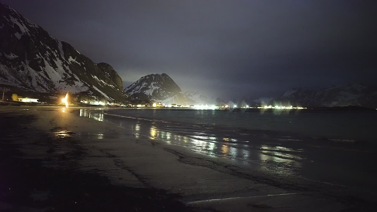 Quiet Beach Of Rambergstranda At Night With Snow Mountains In Ramberg, Norway