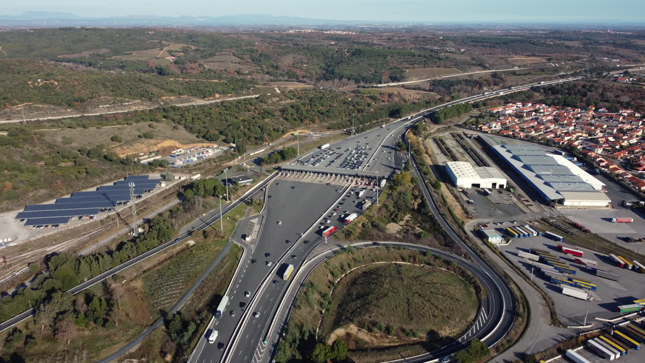 Aerial View of a Highway Toll Plaza and Surrounding Area