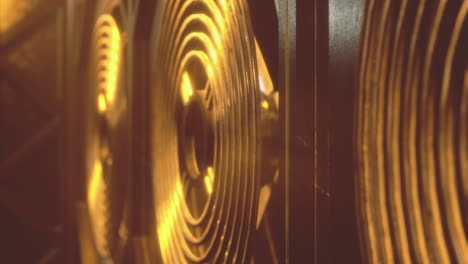 golden whirl of sound from powerful speakers in mesmerizing lighting display