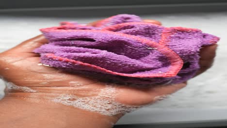 washing a purple cloth