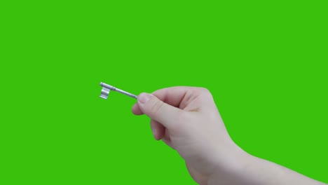 hand holding key and unlocks.isolated on chroma key green screen background.