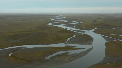 a large, twisting stream flows through the plains of argentina