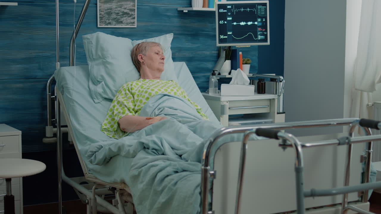 Retired patient with disease sitting in hospital bed