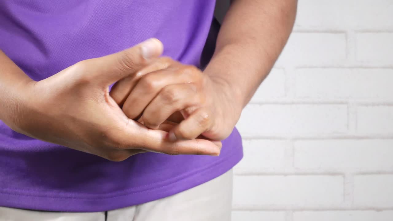 Person massaging their hands