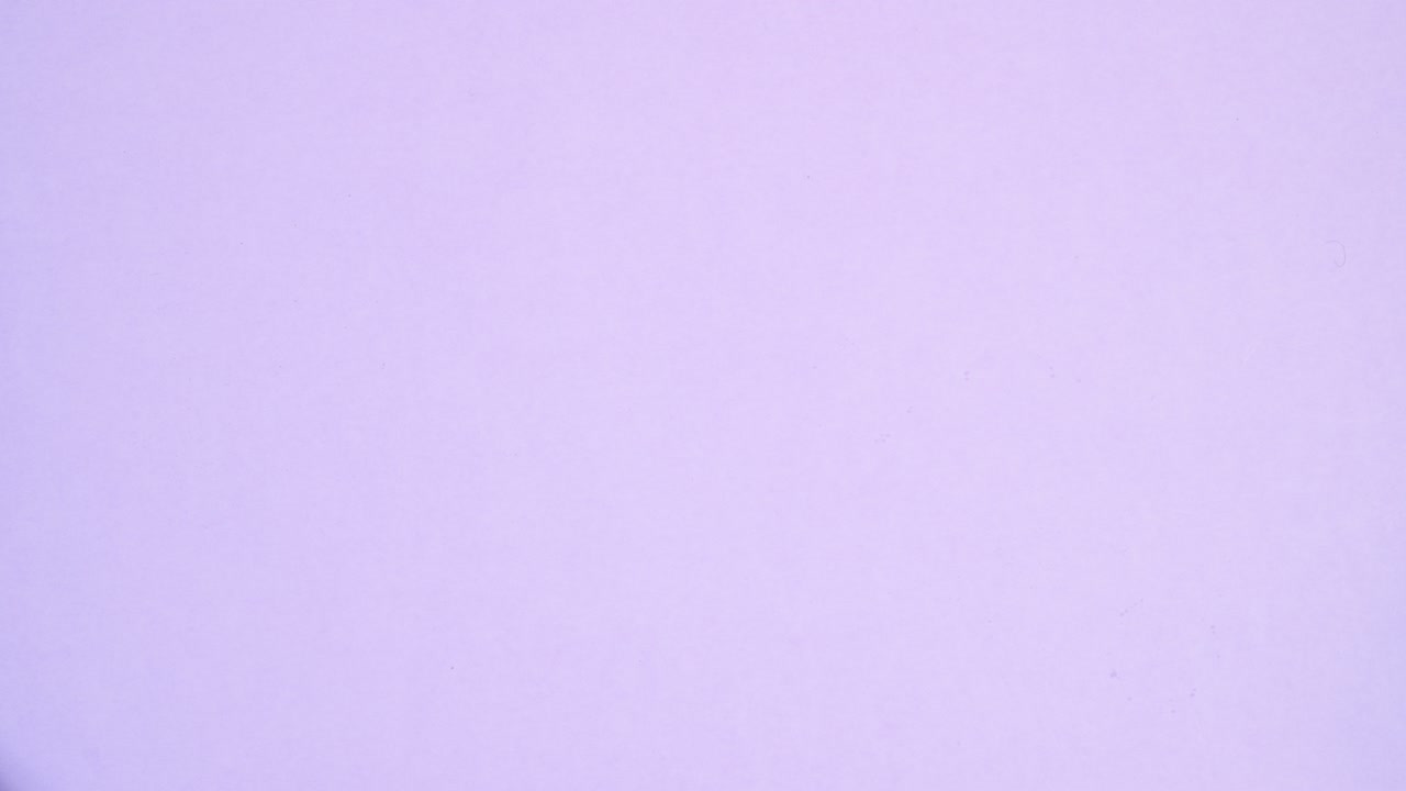 Tools for making cookies appear on left and right side of light purple theme. Stop motion flat lay