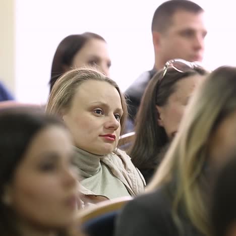 group of people listening on the conference