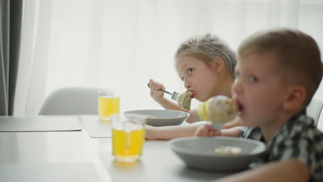 kids eating dumplings at home