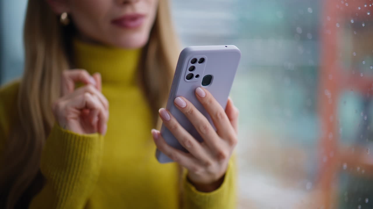 Lady hands scrolling smartphone choosing online purchase in apartment closeup