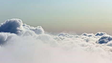 a breathtaking high-altitude aerial view of a vast sea of soft, white cumulus clouds, creating a peaceful and dreamlike skyscape that evokes a sense of freedom and serenity