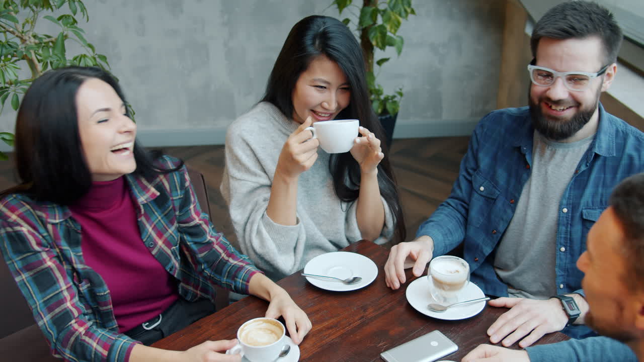 Friends Enjoying Coffee at a Cafe