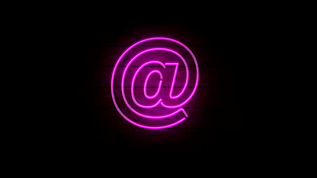 E-mail at neon symbol on brick wall