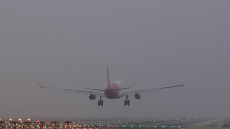airplane landing in foggy conditions