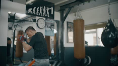 personal trainer working with boxer