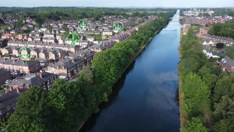 Green-arrow-icon-flashing-above-sunny-British-homes-alongside-long-canal,-Rising-aerial-view
