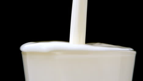 milk pouring into a glass