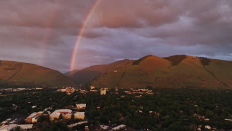 Rainbow-At-Sunset-Over-Mountains-In-Missoula-County,-Montana,-USA