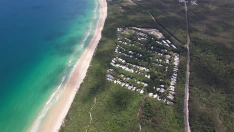 Aerial View Of Rainbow Beach And Holiday Accommodations In Queensland, Australia - Drone Shot
