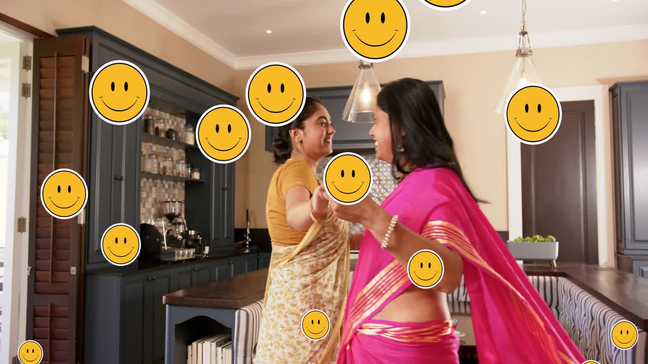 Mom-daughter holding hands spinning in kitchen smiling causing emoji icons covering scene for ads