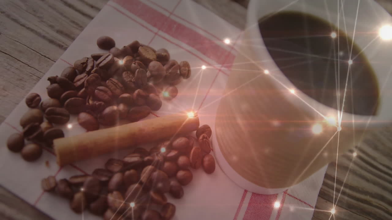 Animated illustration showing beans scattering across cloth napkin while mug steaming with sparkles