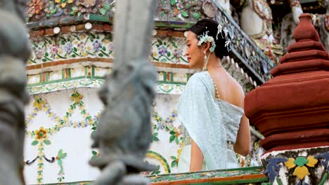 traditional attire amidst intricate temple architecture