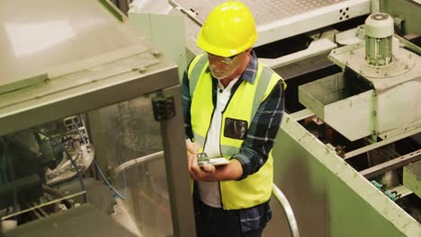 engineer writing on clipboard