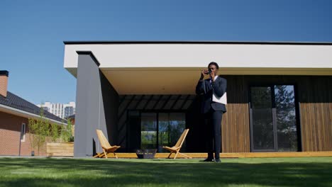 real estate agent inspecting modern house