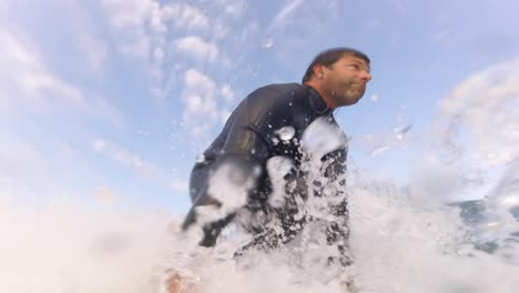 beautiful shot of a professional surfer surfing a perfect wave on a sunrise